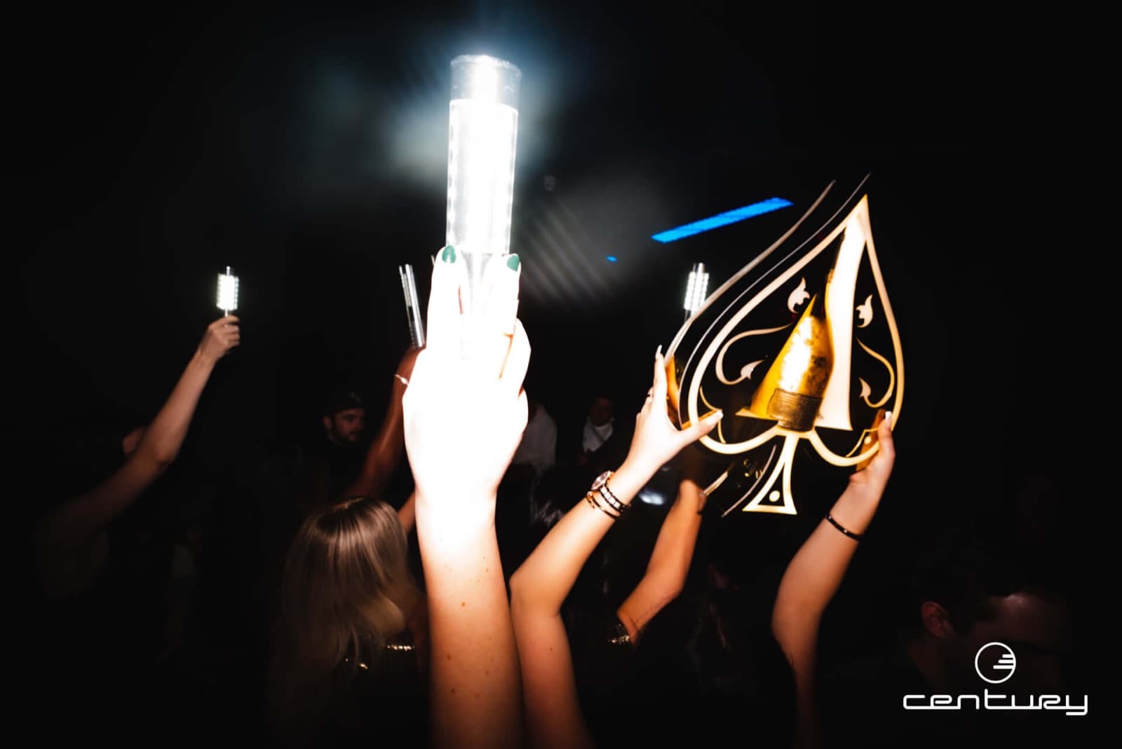 Sparklers and an Ace of Spades bottle held up over the crowd at Century