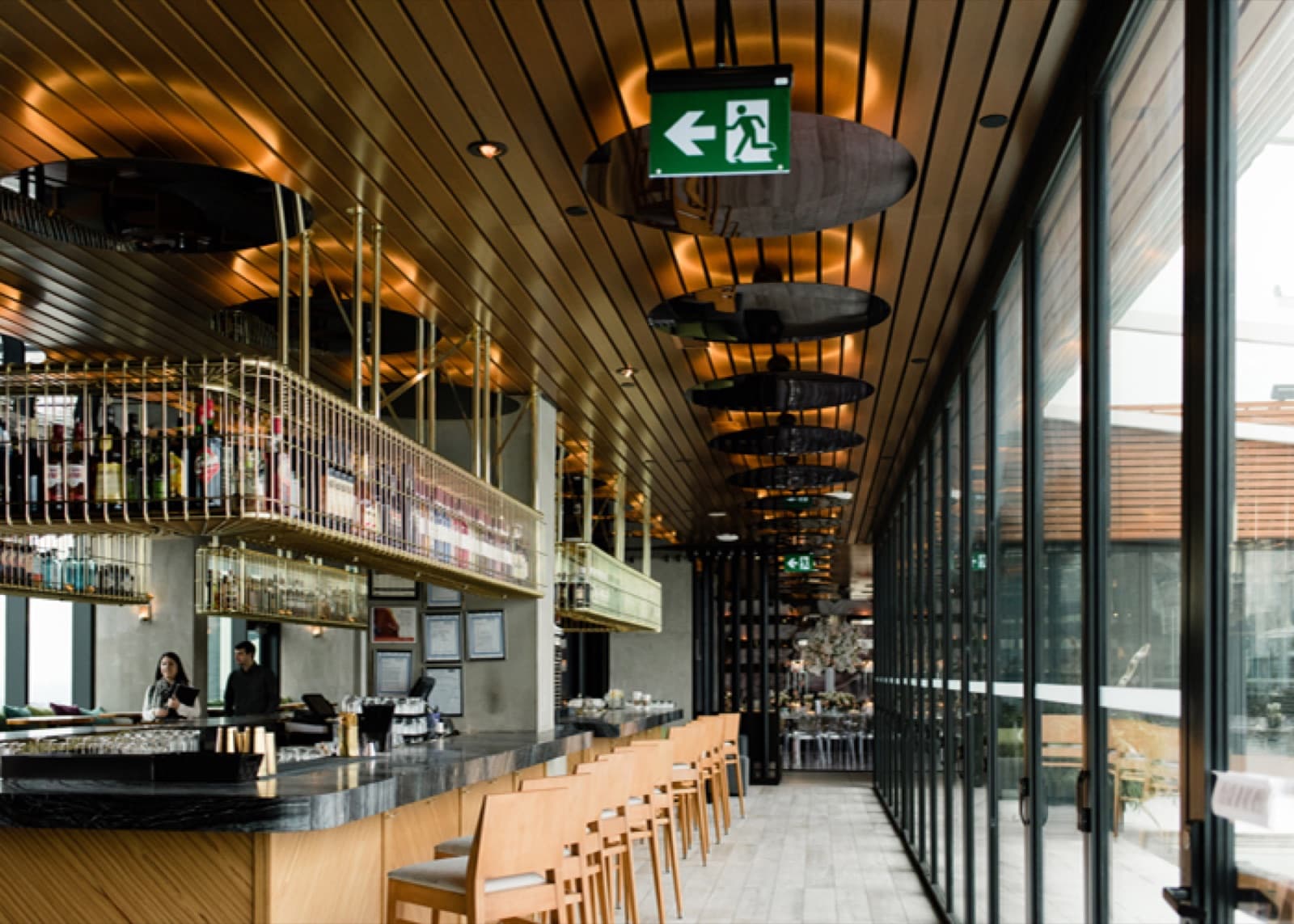 The bar at Lavelle beside floor-to-ceiling windows
